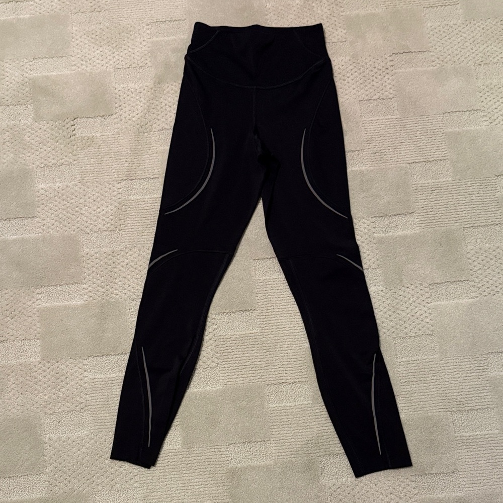 Lululemon Black Leggings with Gray Accents. No size tag, size 0. Perfect logo.